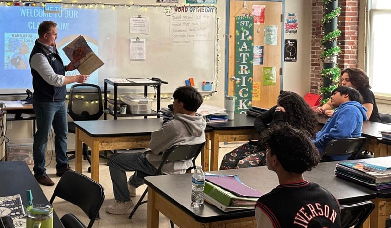 teacher-in-a-classroom-presenting-to-students